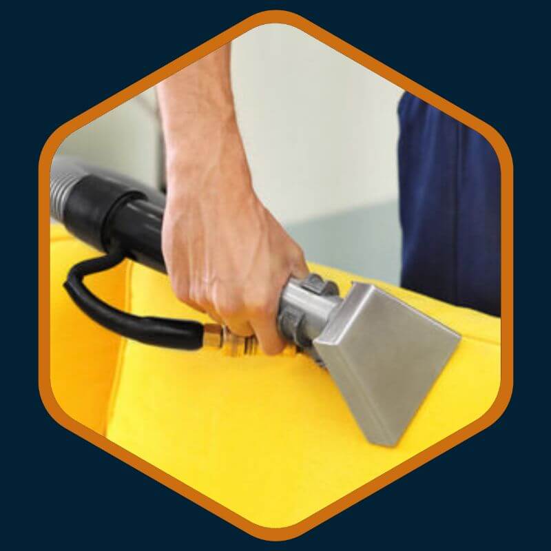 Hand of a professional cleaner from Kairos Upholstery cleaning a couch in Bryanston.